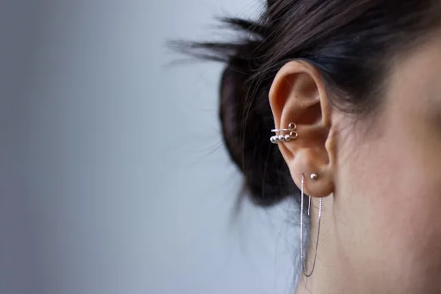A woman showing off her pierced ear