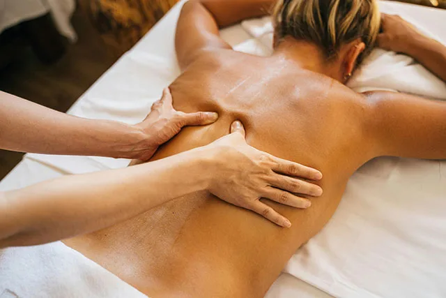 A woman being massaged