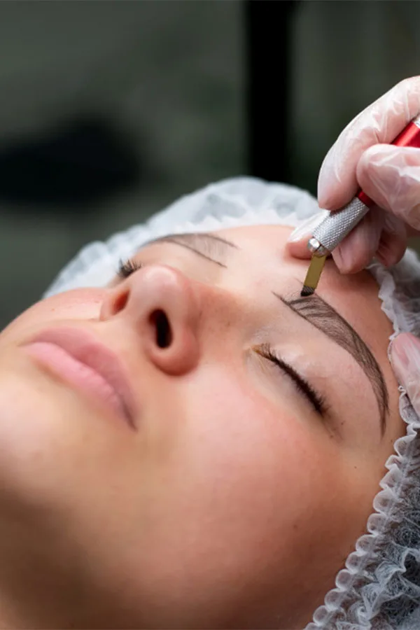 A woman who is semi-permanent eyebrow makeup applied