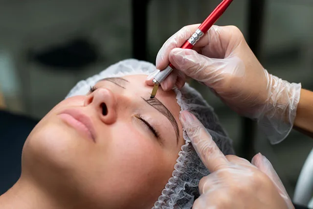 A woman who is semi-permanent eyebrow makeup applied